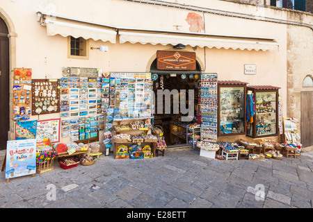 Souvenir shop in Otranto, Puglia, Salento Region, southern Italy with colourful display of postcards and tourist souvenirs Stock Photo