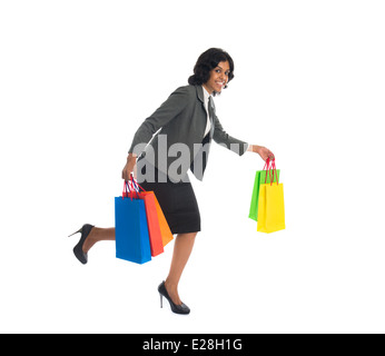 indian business woman running while shopping Stock Photo