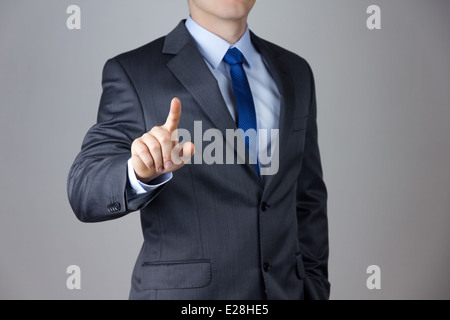 Business man touching an imaginary screen Stock Photo