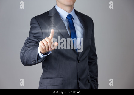 Business man touching an imaginary screen Stock Photo
