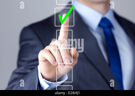 Businessman making right decision touching screen interface Stock Photo