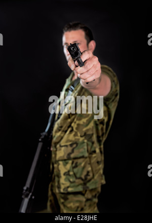Spanish military with SMG and gun on black background Stock Photo