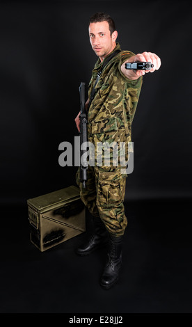 Spanish military with SMG and gun on black background Stock Photo