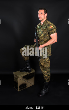 Spanish military with SMG on black background Stock Photo