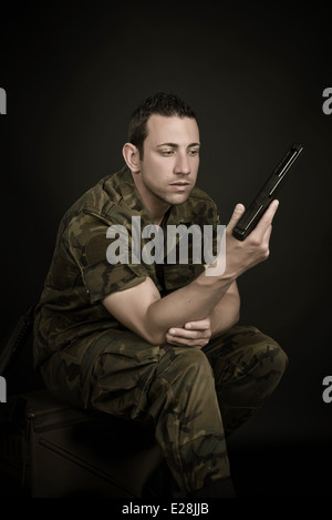 Spanish military with gun on black background Stock Photo