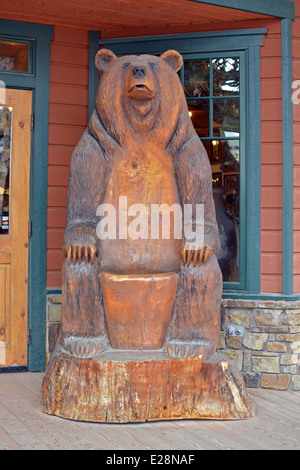 A large wooden sculpture of a bear at the Jackson Trading Company in Jackson Hole, Wyoming, Stock Photo