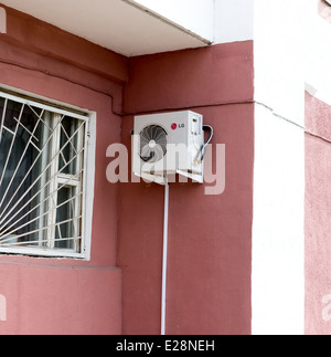 Air conditioner remote control hanging on wall Stock Photo - Alamy