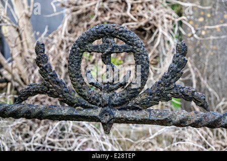 Rusty wrought iron image of the anchor insignia of the British Royal Navy on a grave at Mornington, co. Louth Ireland Stock Photo
