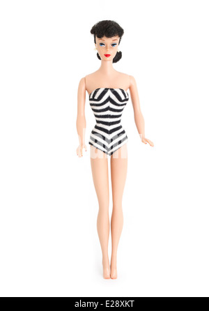 Barbie fashion doll by Mattel first created 1959 brunette, ponytail, black and white zebra swimsuit, straight leg.1961 pearl earrings , eyebrows Stock Photo