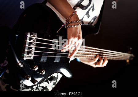 Girl Playing Bass guitar Stock Photo