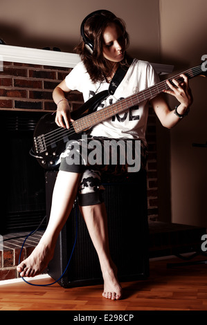 Girl Playing Bass guitar Stock Photo