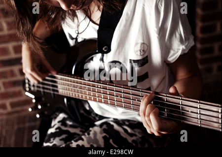 Playing Bass guitar Stock Photo