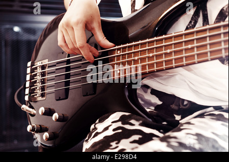 Playing Bass guitar Stock Photo