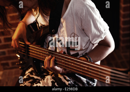 Girl with bass guitar Stock Photo