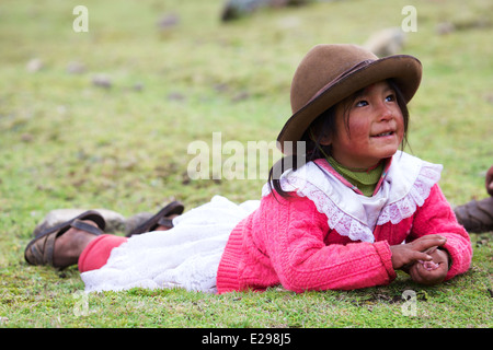 A portrait of a young Quechua girl in traditional native dress in the Lares Valley in the Andes, Peru, South America Stock Photo