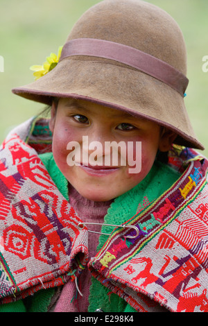 A portrait of a young Quechua girl in traditional native dress in the Lares Valley in the Andes, Peru, South America Stock Photo