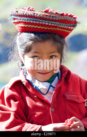 Norma, a small girl of the Huacawasi Valley high in the Andes, wearing her traditional Quechua hat. Stock Photo
