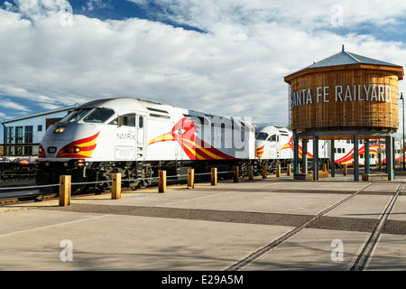 Water tank and Railrunner Express commuter train, Santa Fe Railyard, Santa Fe, New Mexico USA Stock Photo