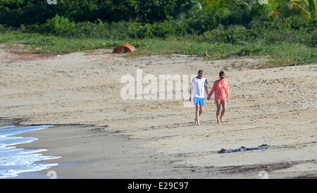 Santo Andre, Brazil. 17th June, 2014. Andre Schuerrle (l) on the beach with girlfriend Montana Yorke in Santo Andre, Brazil, 17 June 2014. The FIFA World Cup 2014 will take place in Brazil from 12 June to 13 July 2014. Photo: Thomas Eisenhuth/dpa/Alamy Live News Stock Photo