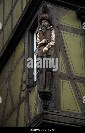 Embedded wooden sculpture on a half-timbered building, Colmar, France Stock Photo