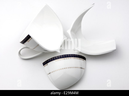 Three pieces of broken cup on white background Stock Photo