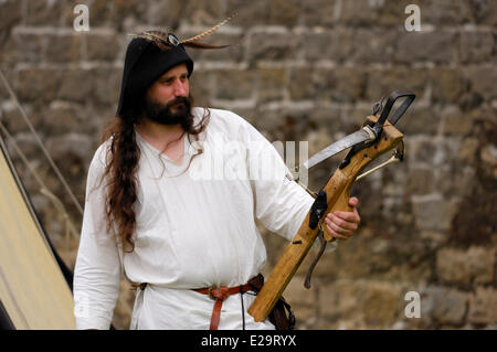 France, Ardennes, Sedan, medieval festival, man with crossbow Stock Photo