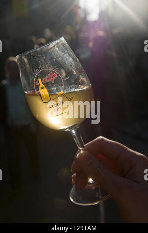 France, Jura, Arbois, breakthrough of the yellow wine, glass of yellow wine Stock Photo