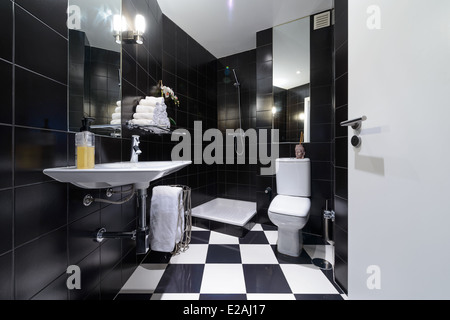 Modern bathroom with black tiles Stock Photo