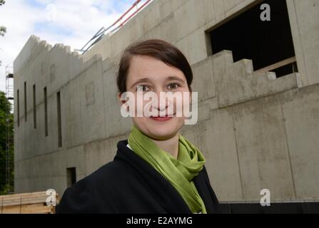 Kassel, Germany. 17th June, 2014. ATTENTION - EMBARGO CONDITION - 18 JUNE 2014 - 15:00 PM - Project manager Susanne Voelker poses on the construction site of the 'Grimmwelt' ('Grimm World') in Kassel, Germany, 17 June 2014. The house on the life and work of the collectors of fairy tales and linguists Jacob and Wilhelm Grimm is scheduled to be opened in mid 2015. Photo: Uwe Zucchi/dpa/Alamy Live News Stock Photo