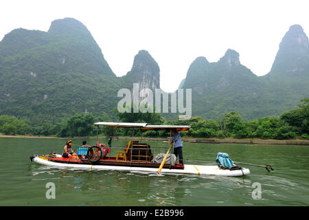 China, Guangxi province, Guilin region, Karst mountain landscape and Li River around Yangshuo, Chinese tourist on a raft Stock Photo