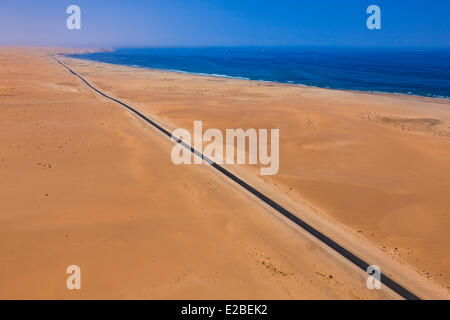 Namibia, Erongo Region, between Sawkopmund and Walvis Bay, beach, sand dunes, road (aerial view) Stock Photo