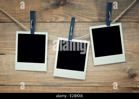 empty polaroid photo frames on wooden background Stock Photo