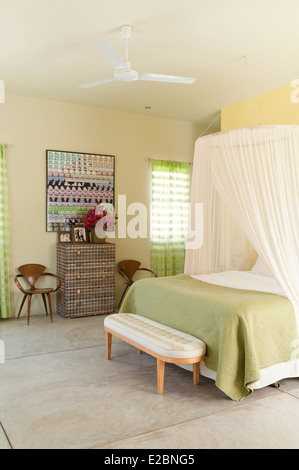 Pastel green bedroom in Baja home of English interior designer Jenny Armit Stock Photo