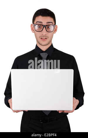 Surprised Young Man with Glasses Holding Laptop Stock Photo