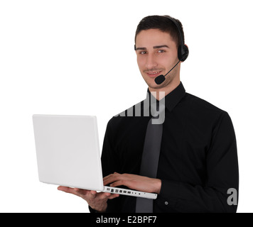 Young Man with Headset Holding Laptop Stock Photo