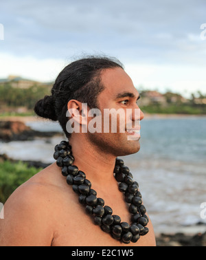 Hawaiian entertainer in Wailea, Maui, with Wailea Beach in background Stock Photo