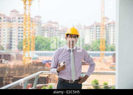 indian male engineer inspecting site with construction background Stock Photo