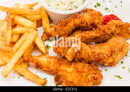 Fried chicken tenders served with french fries and cole slaw. Stock Photo