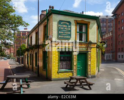 Peveril of the Peak is a Grade II listed building. a  Public house and hostelry in Great Bridgewater Street, Manchester, UK