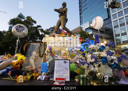 San Diego, California, USA. 18th June, 2014. Flowers and tributes surround a statue at Petco Park of former San Diego Padres player Tony Gwynn, who died of cancer earlier in the week. Gwynn wore number 19 and played for the Padres for 20 seasons. Credit:  KC Alfred/ZUMAPRESS.com/Alamy Live News Stock Photo