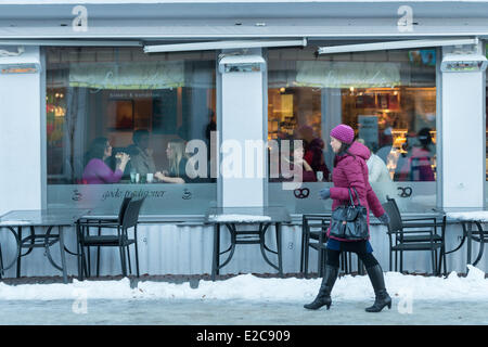 Norway, Finnmark, Kirkenes, cafe and woman in the town centre Stock Photo