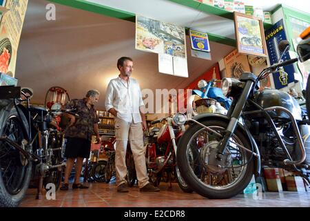 France, Herault, Boujan sur Libron, Chapy museum, exhibition of former motorcycles, visitor in a path Stock Photo