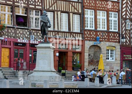 France, Ille et Vilaine, Rennes, Place du Champ Jacquet, square lined with 17th century half timbered houses, statue of John Leperdit, master tailor and former mayor of Rennes Stock Photo