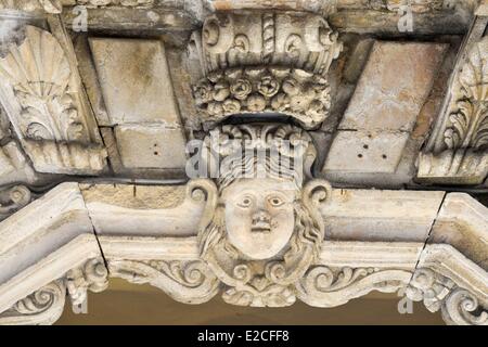 Italy, Sicily, Trapani, historic center, Via Vittorio Emanuele, Ferro Palace, detail of carving entrance gate Stock Photo