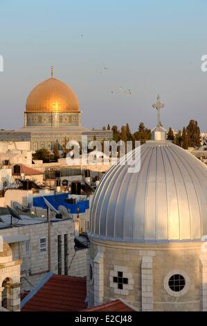 Israel, Jerusalem, holy city, the old town listed as World Heritage by UNESCO, the roofs of the Muslim District, the church of Our Lady of the Spasm and the Dome of the Rock in the background Stock Photo