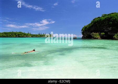 France New Caledonia Isle of Pines Kuto Bay Kanumera swimmer with his tuba Stock Photo