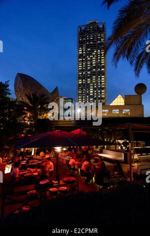 Spain Catalonia Barcelona Barcelonata Olympic Port restaurant terrace with Hotel Arts in the background Stock Photo