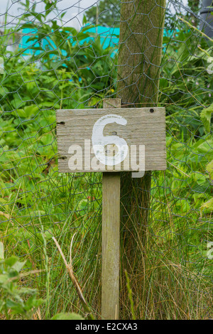 Wooden sign giving garden plot number Stock Photo