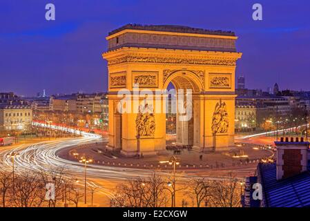France Paris Place de l'Etoile (Place Charles de Gaulle) the Arc de Triomphe illuminated at night the Champs Elysees avenue in Stock Photo