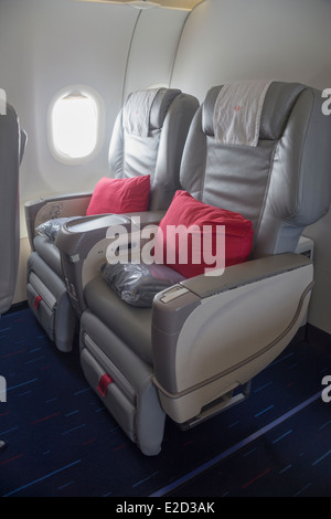 Aircraft cabin and passenger with hat Stock Photo